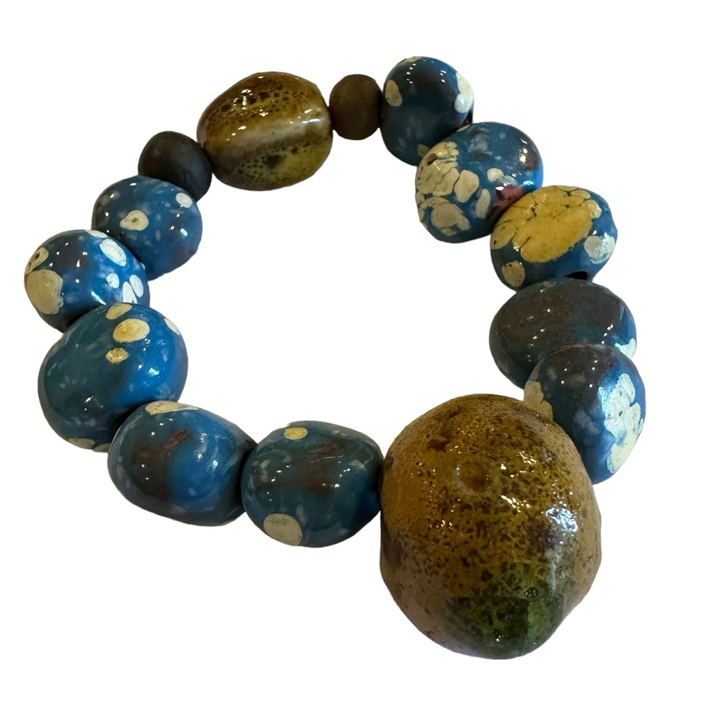 Teal and brown stone handmade bracelet from Belize. Stretchy local